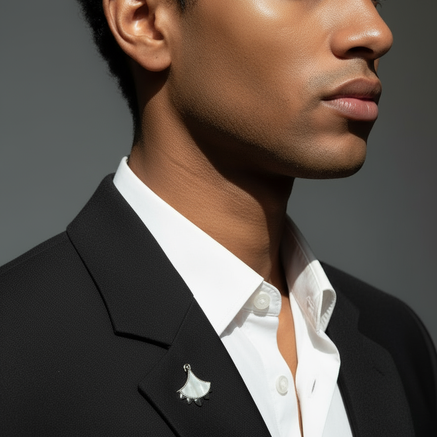 Man wearing a Cirque D'Or Mother Of Pearl and Zircon Brooch in Rhodium on Sterling Silver finish.