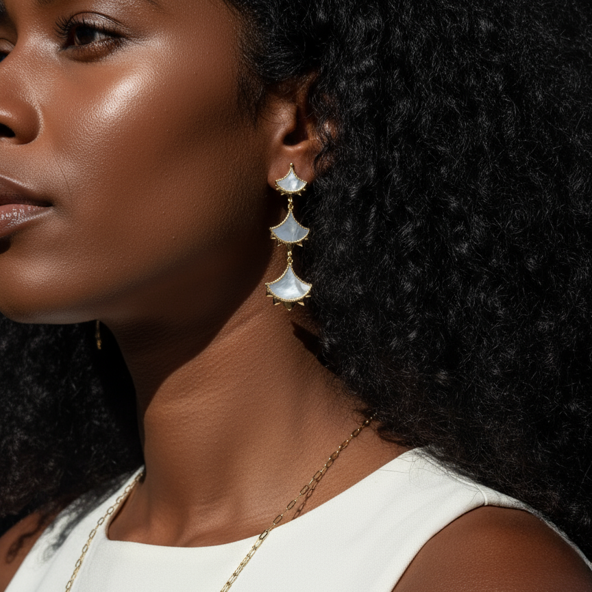 Woman wearing a pair of Cirque D'Or Mother Of Pearl and Zircon Statement Drop Earrings in Gold Vermeil on Sterling Silver finish.