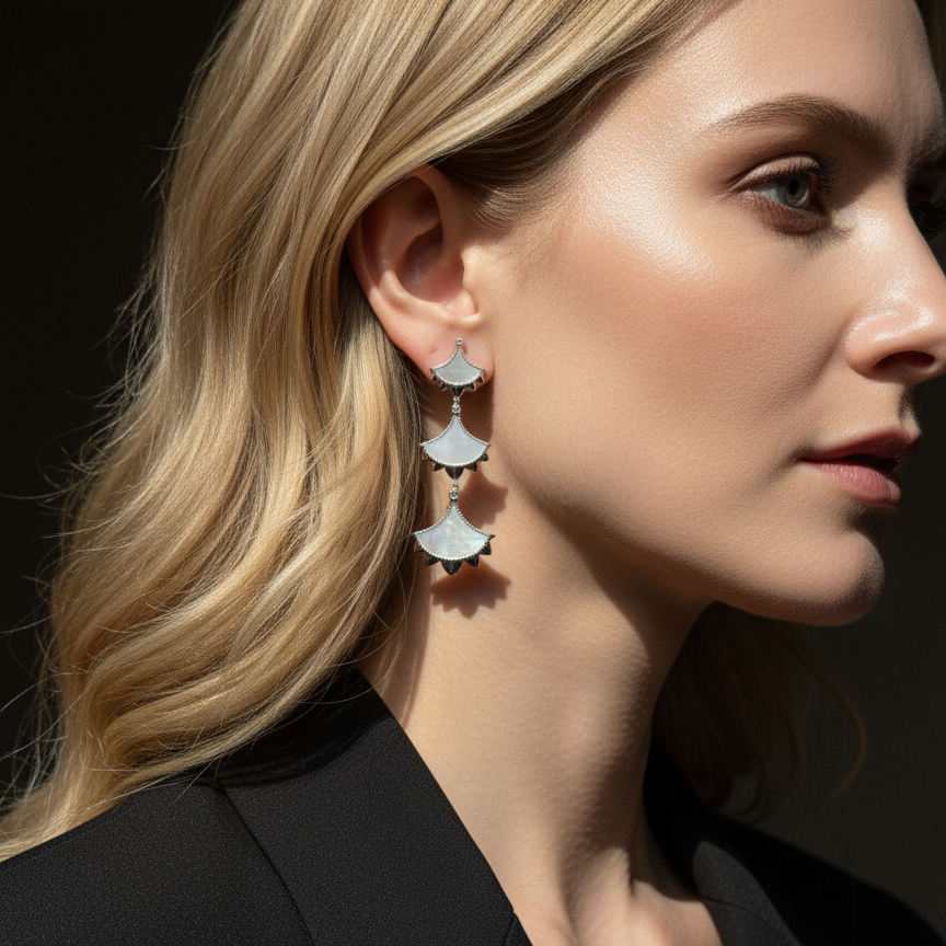 Woman wearing a pair of Cirque D'Or Mother Of Pearl and Zircon Statement Drop Earrings in Rhodium on Sterling Silver finish.