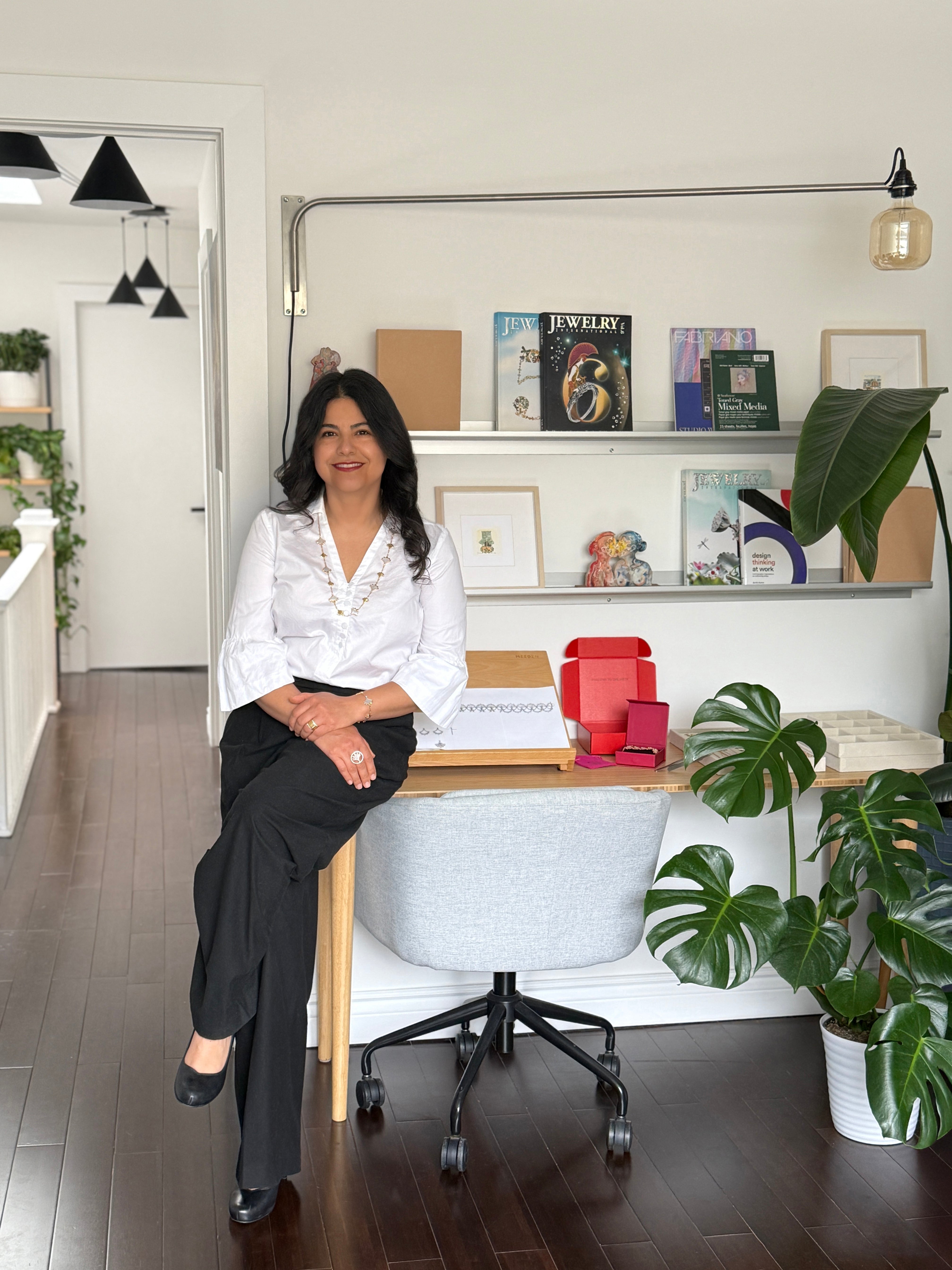 Founder of Cirque D’Or, in her Toronto studio with jewelry books and tools, reflecting a sustainable, artistic design style | Cirque D’Or Canada USA