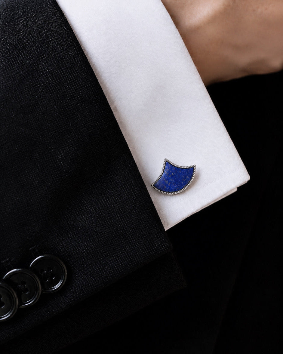 Lapis lazuli fan cufflink on a white shirt cuff
