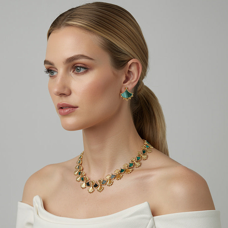 Woman wearing a Malachite and Zircon necklace from Cirque D'Or in Vermeil on Sterling Silver.