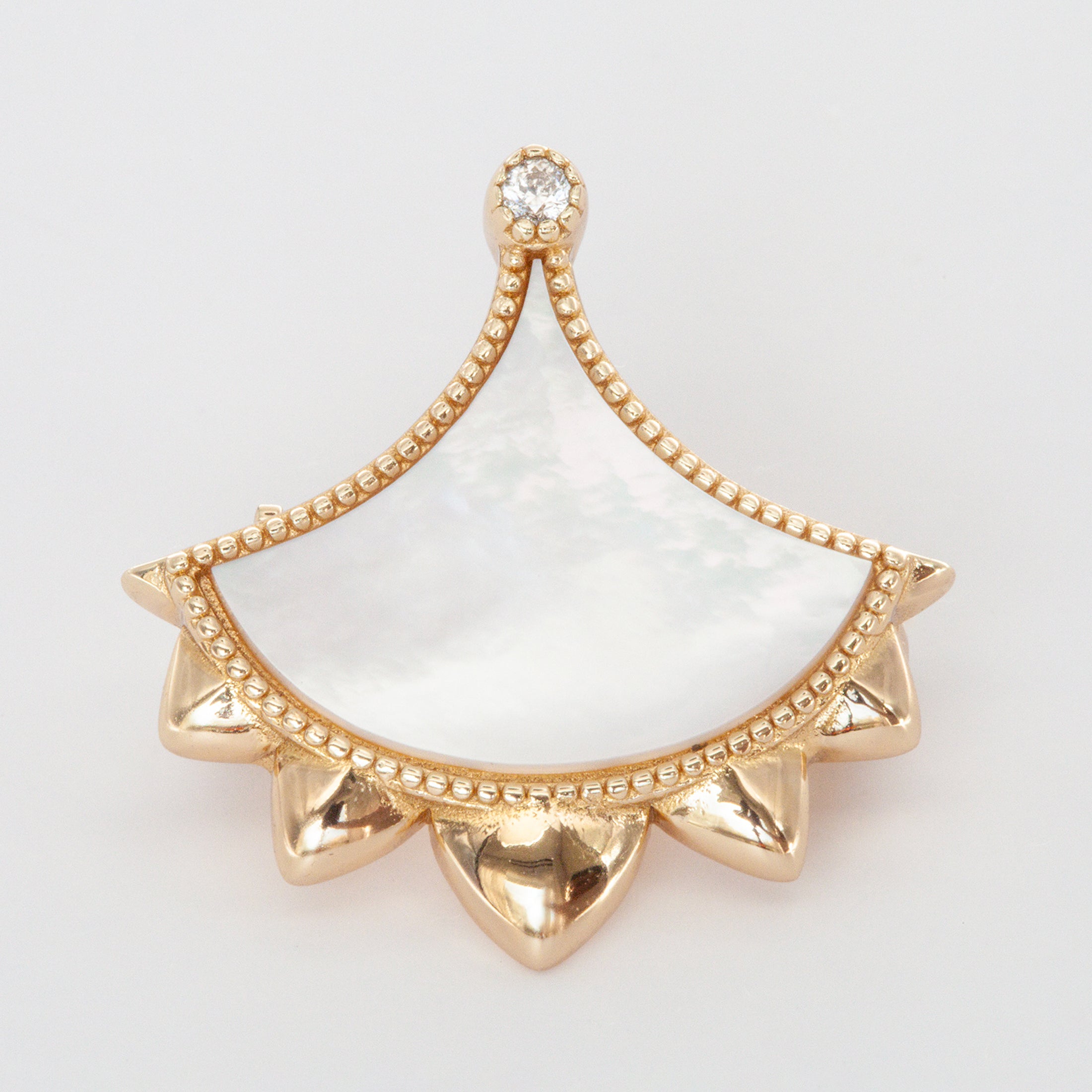 Handcrafted gemstone brooch in precious metal with artisanal detailing