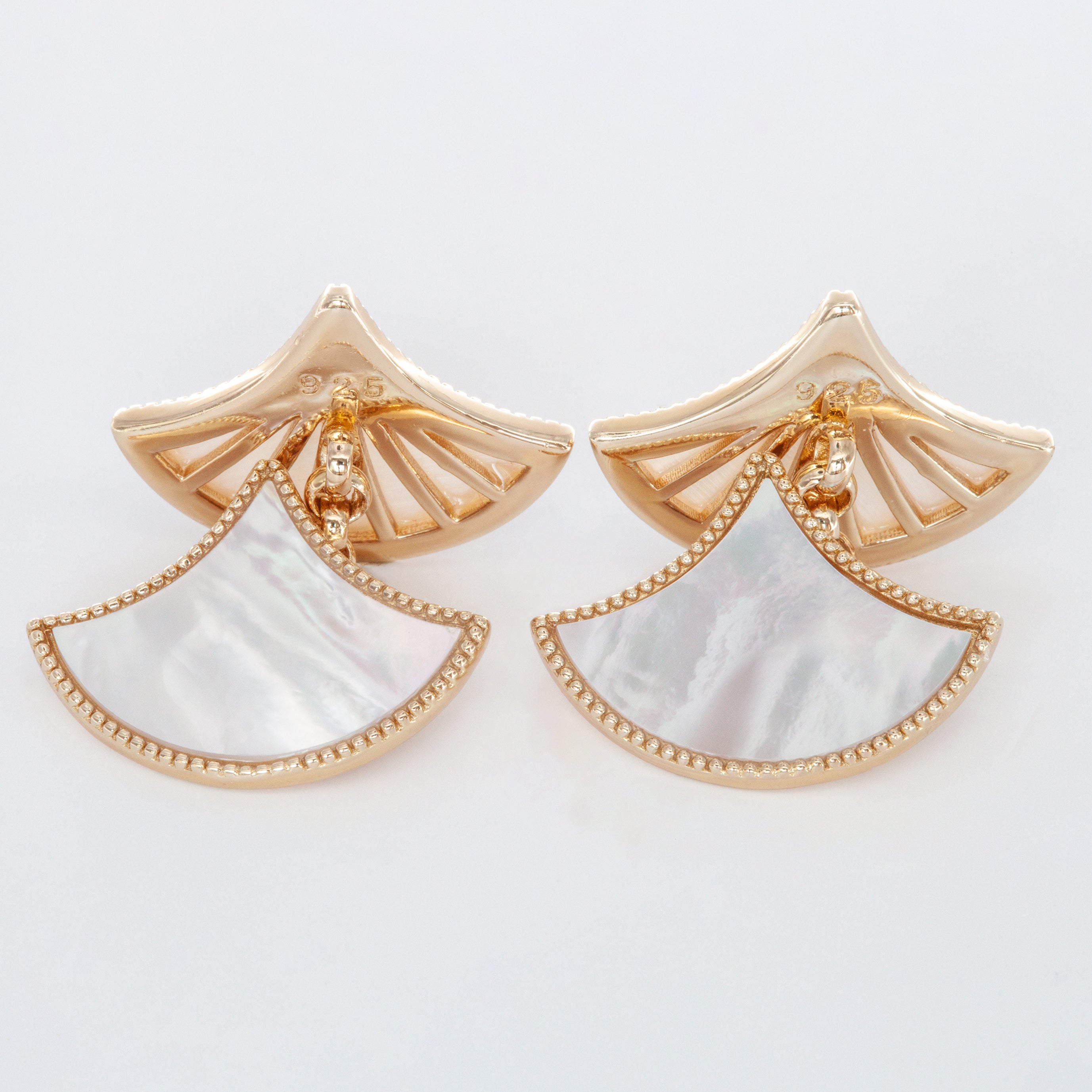Elegant cufflinks in polished metal with subtle Mother Of Pearl accents.