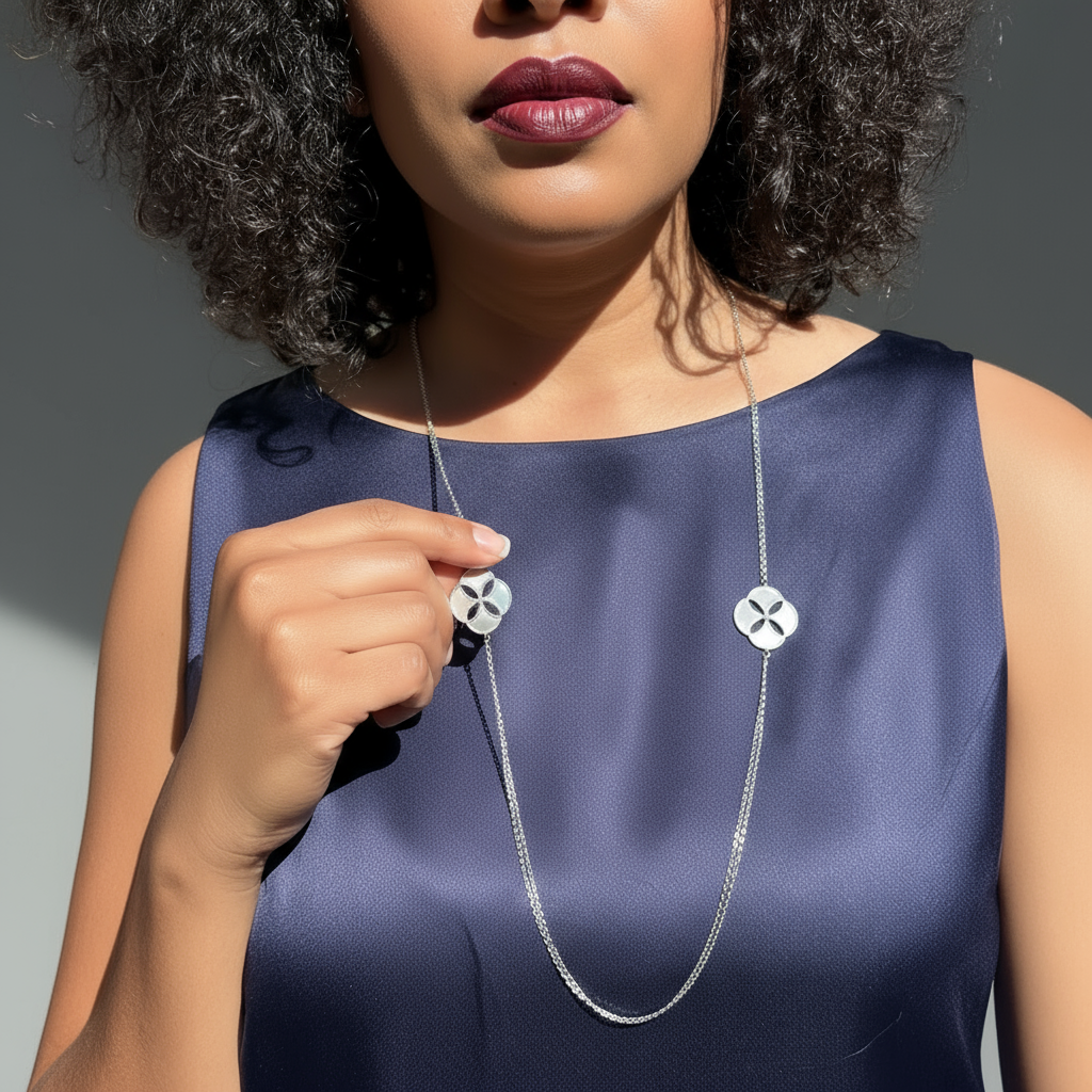 Woman wearing a Mother Of Pearl and Zircon necklace from Cirque D'Or in Rhodium on Sterling Silver finish.