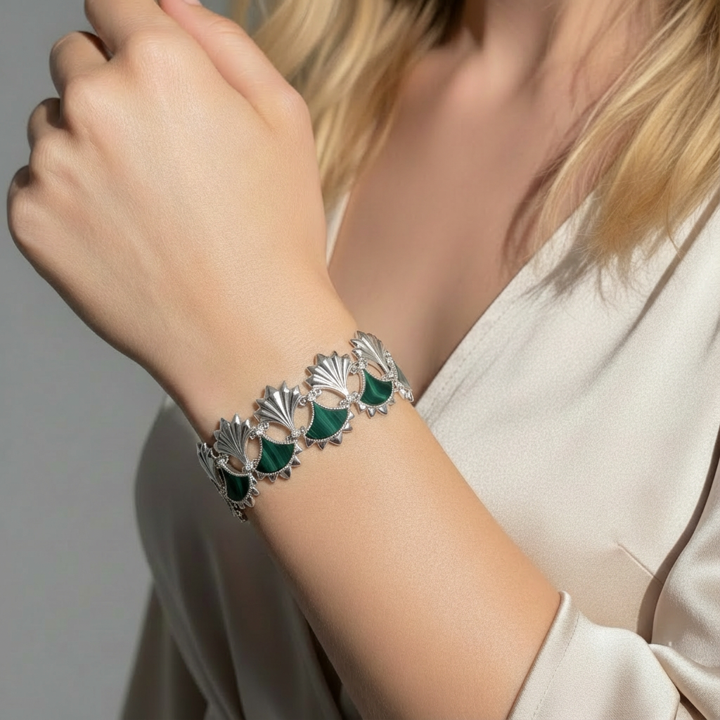 Woman wearing a Malachite and Zircon Bracelet from Cirque D'Or in Rhodium on Sterling Silver finish.