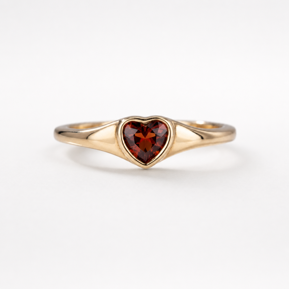 Heart-shaped garnet ring in 18kt gold vermeil over sterling silver, shown on a neutral background | Cirque D'Or Canada USA