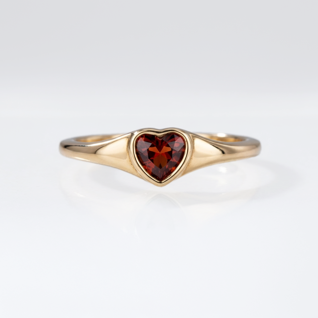 Heart-shaped garnet ring in 18kt gold vermeil over sterling silver, shown on a neutral background | Cirque D'Or Canada USA
