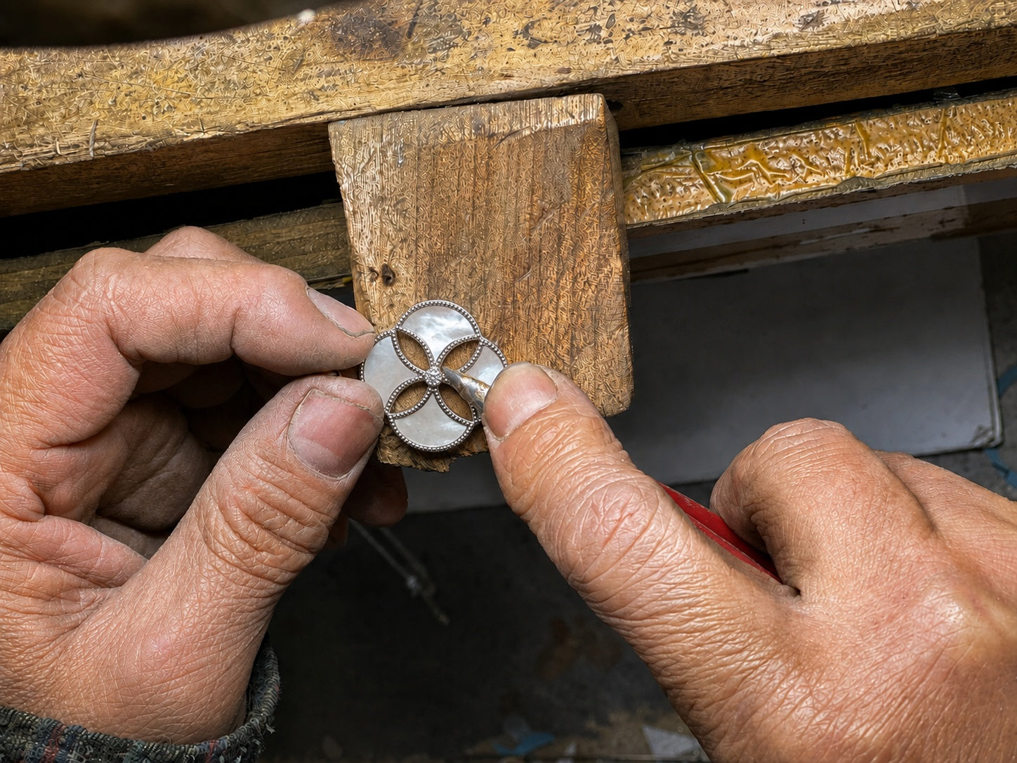 Dôme Mother of Pearl pendant being set at the jewellery bench